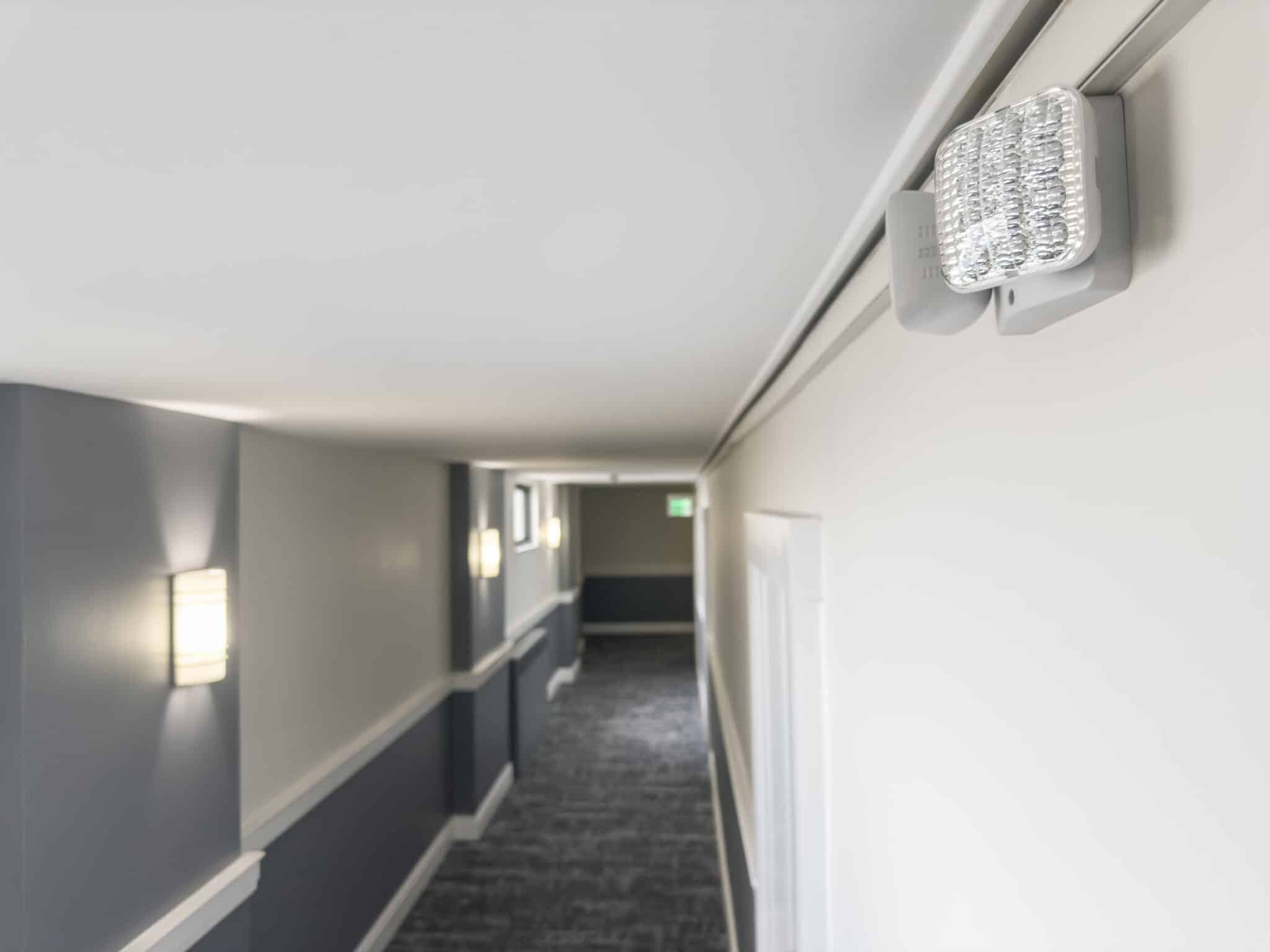 Emergency lighting in building corridors.