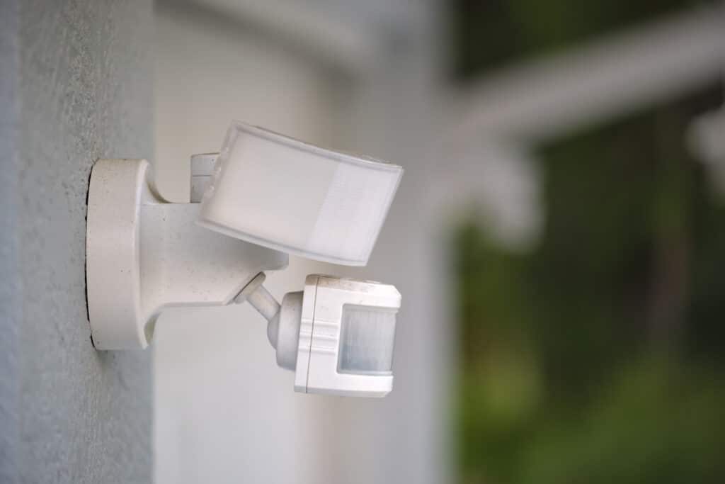 Motion-Sensor Lighting detector mounted on exterior wall.