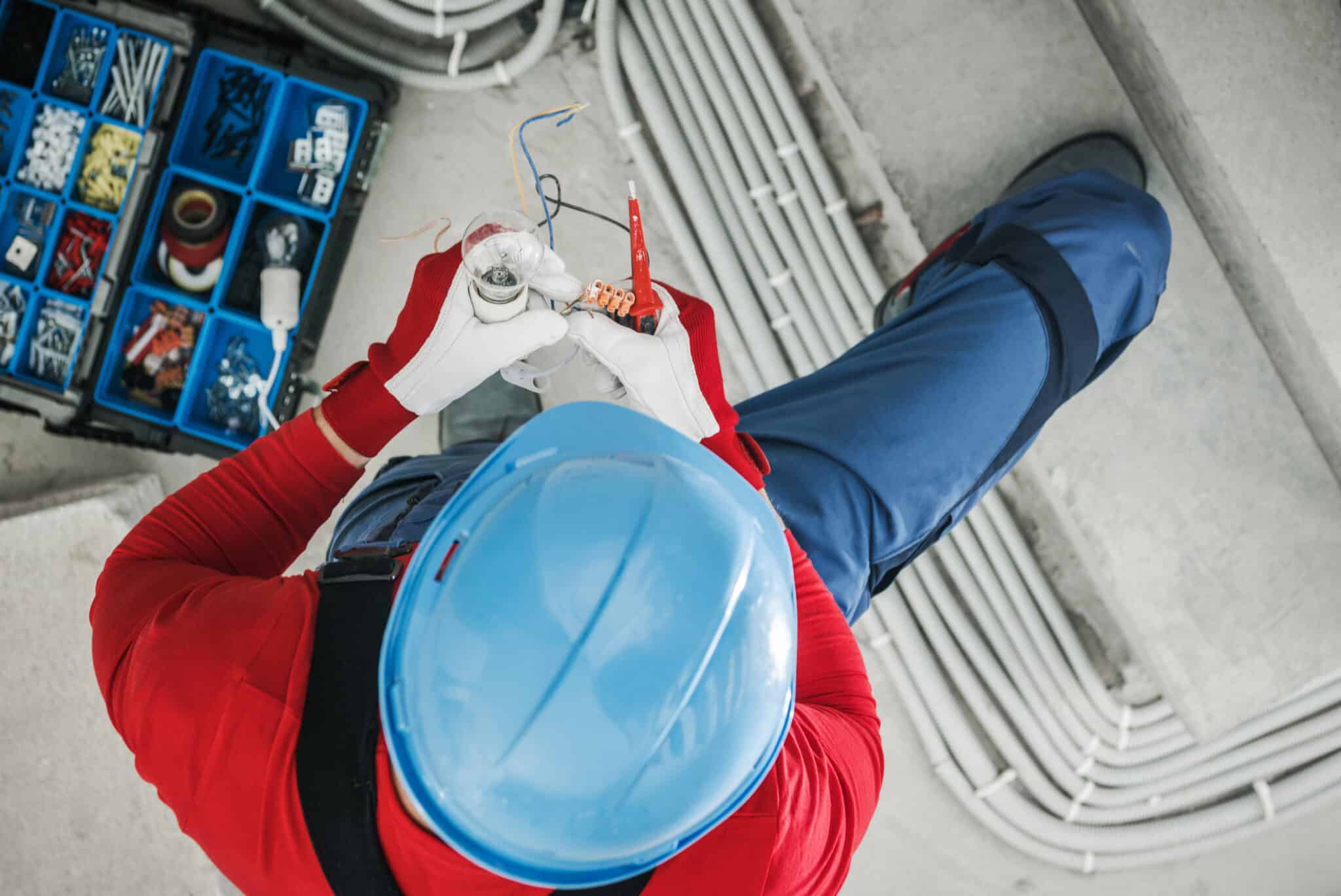 Electrician Contractor Installing Light Point, Right Electrician.